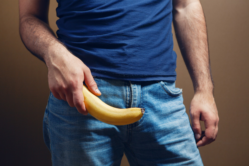 banana-male-penis-size-concept-brown-background